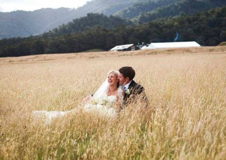 Adam and Anna in long grass at Stables3